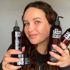 scalp kit person holding the products